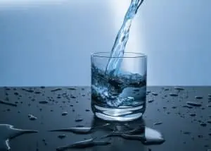 pouring clean water in a glass