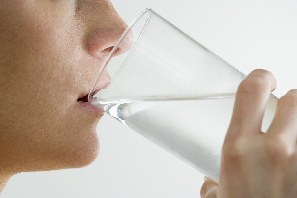 person drinking clean filtered water