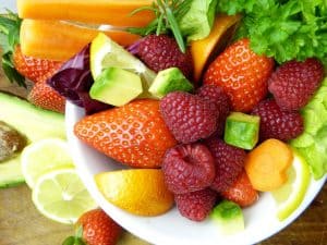 plate of alkaline fruit - berries, citrus and avocado